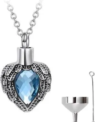 Imagen del producto de Soporte elegante para ceniceros con cadena, ideal para cenizas, cabello o perfume. Joya conmemorativa que incluye un pequeño recipiente y una bolsa de almacenamiento. Diseño moderno con forma de corazón