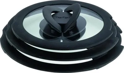 A set of three glass lids with black silicone rims and handles, stacked on top of each other.