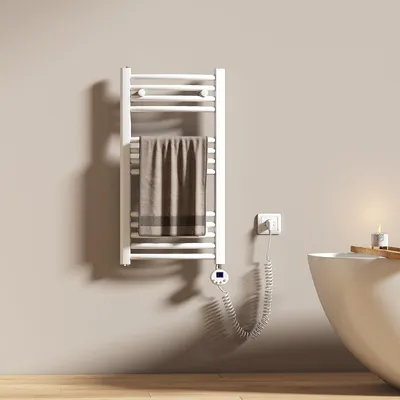 A bathroom setting with a towel warmer and a bathtub.