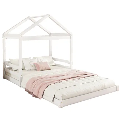 A white wooden house bed with a mattress and bedding.
