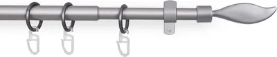 A close-up of a curtain rod with rings.