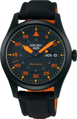 A close-up studio shot of a black Seiko 5 automatic watch with orange accents and a black and orange fabric strap.
