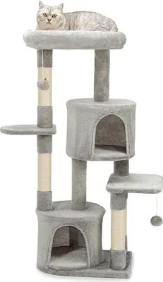 A cat is lying on top of a multi-level cat tree.