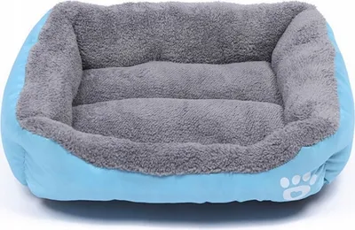 A blue and gray dog bed with a paw print logo on the side.