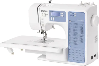 A white Brother sewing machine with a blue control panel and extension table, shown against a white background.