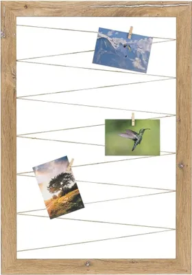 A wooden frame with strings holding three photographs.