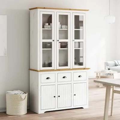 A white and brown highboard cabinet with glass doors, displayed in a bright, sparsely furnished room.