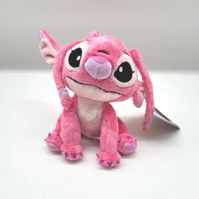 A pink plush toy of the character Angel from Lilo & Stitch sits on a white background.