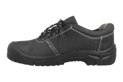 A side view of a black work shoe against a white background.
