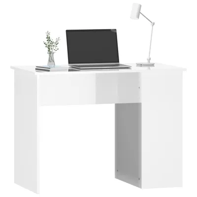 A white desk with a laptop, a vase with plants, and a lamp on it, against a white background.