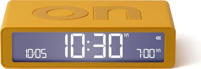 A yellow digital alarm clock with a blue display showing the time and alarm settings.