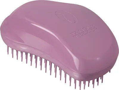A single purple hairbrush on a white background.
