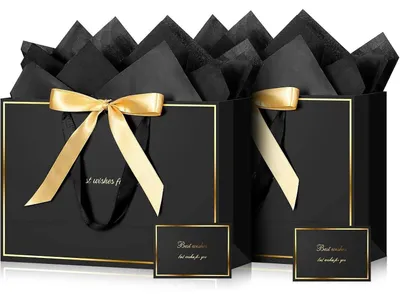 Productafbeelding van Set van twee zwarte cadeautasjes met gouden details, inclusief linten en wenskaarten, afmetingen 32x22x11 cm