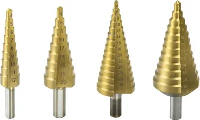 Four gold-colored step drill bits of varying sizes are arranged in a row against a white background.