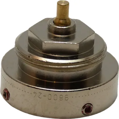 A close-up studio shot of a metal adapter part.