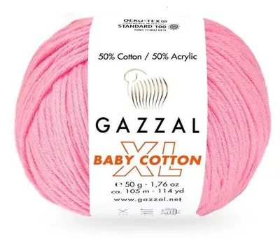 A ball of pink yarn with a label showing product details.