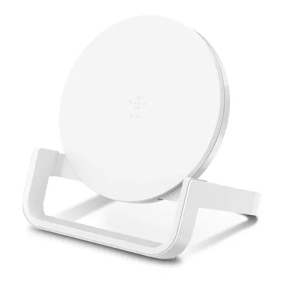 A white wireless charging stand with a circular charging pad is shown against a white background.