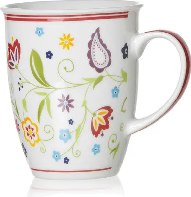 A white ceramic mug with a floral and paisley pattern.
