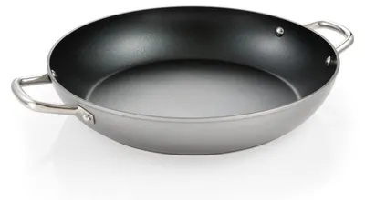 A close-up studio shot of a large, shallow frying pan with two handles.