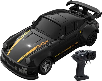 A black remote control drift car with yellow racing stripes and a remote control.