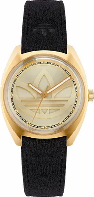 A close-up studio shot of a gold and black Adidas watch.