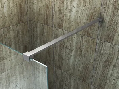 A close-up view of a shower screen support bar attached to a tiled wall.