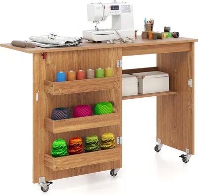 A sewing table with a sewing machine and various sewing supplies.