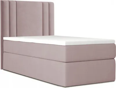 A pink upholstered bed frame with a headboard and mattress topper, shown from a side angle against a white background.