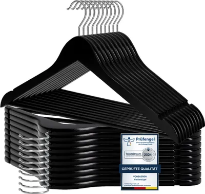 A stack of black wooden hangers with silver hooks, presented against a white background, with a certification badge visible.