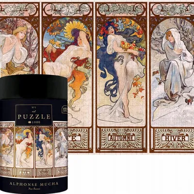 A cylindrical puzzle box is placed in front of a puzzle depicting Alphonse Mucha's "Four Seasons" artwork.