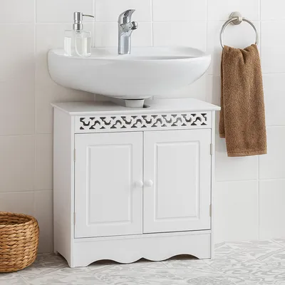 A white bathroom vanity cabinet with a sink and faucet.