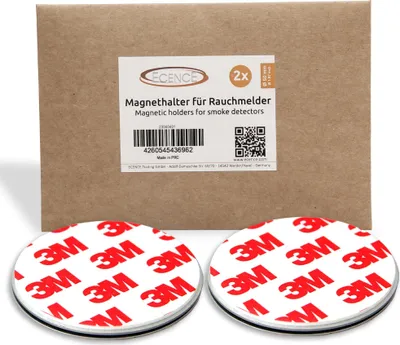 A product package with two magnetic holders for smoke detectors shown in front of it.