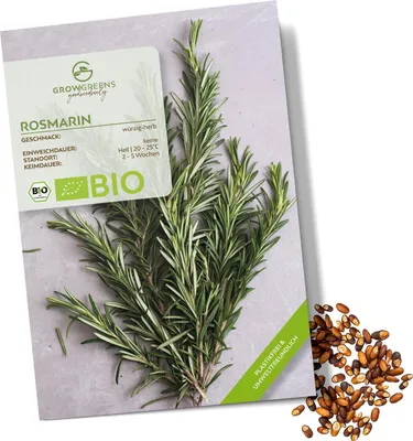 A package of rosemary seeds with fresh rosemary sprigs and loose seeds scattered around.