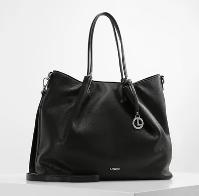 A black leather shopper bag is displayed against a white background.