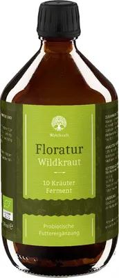 A brown glass bottle of Floratur Wildkraut with a green label.