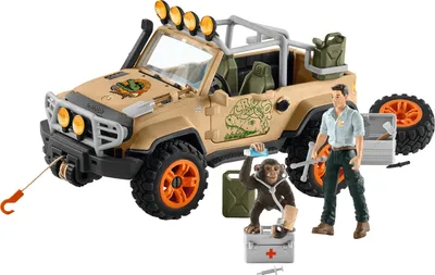 A toy safari jeep with accessories, a toy figure of a man, and a toy chimpanzee.