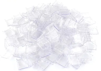 A pile of transparent plastic window panels.