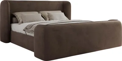 A brown upholstered bed with pillows and a duvet.