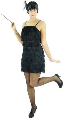 A woman in a flapper dress posing with a cigarette holder.