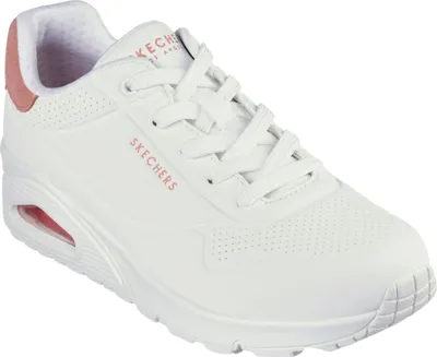 A white Skechers sports shoe with pink accents.