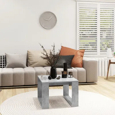 A living room scene with a sofa, coffee table, and decorative items.