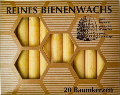 A box of beeswax candles with a honeycomb design.