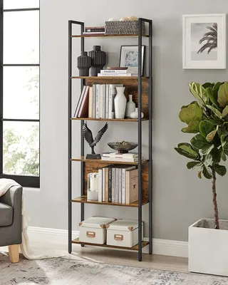 A tall, multi-shelf bookcase filled with books and decorative items, placed in a room next to a window and a large plant.