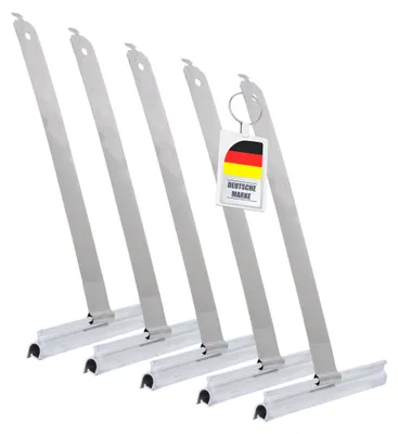 A group of five roller shutter suspension springs, with a German flag keychain attached to one of them.
