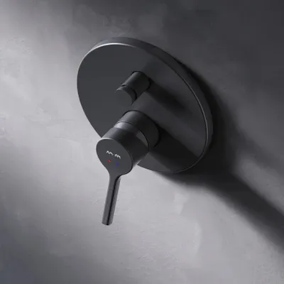 A black shower mixer tap mounted on a textured gray wall.