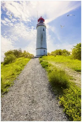 Produktbild von Wallario Premium Glasbild, freischwebende Optik, kräftige Farben, Größe 90 x 60 cm Motiv Leuchtturm auf Hiddensee bei Sonnenschein