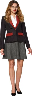 A woman wearing a blazer and skirt.