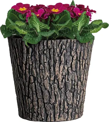 A potted plant with pink flowers and green leaves in a brown planter with a wood-like texture.