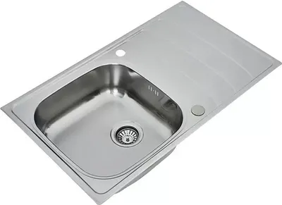 A stainless steel kitchen sink with a drainboard.