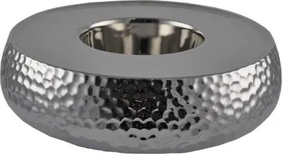 A silver, hammered metal candle holder base.